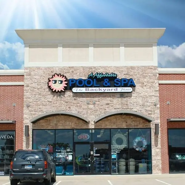 The A-Affordable Pool and Spa storefront on West Hebron Parkway in Carrollton, sign reading The Backyard Place